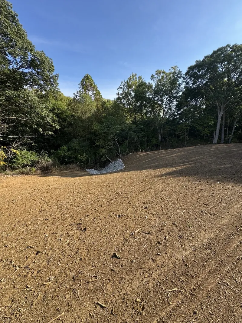 Gravel driveway curve with graded earth