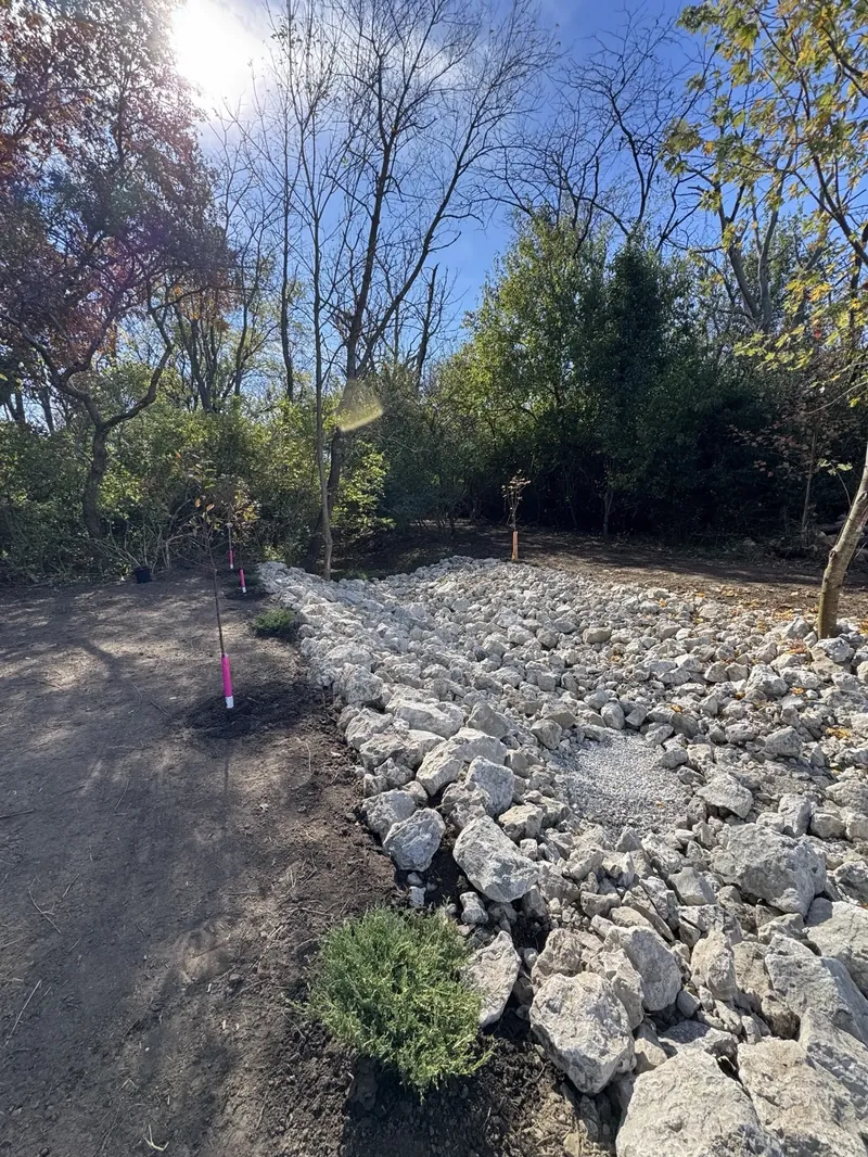 Rip-rap stone embankment along driveway